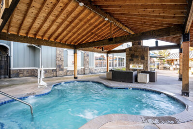 Outdoor lounge with spa and fire pit